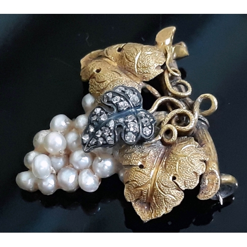 193 - A yellow metal brooch naturalistically formed as a grape vine set with diamonds and pearls, unmarked... 