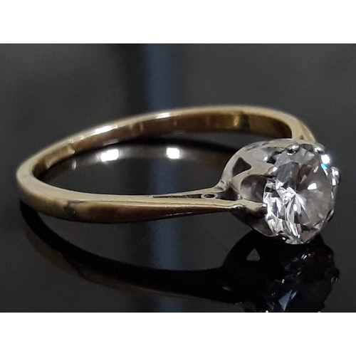 92 - A single stone diamond solitaire ring, the diamond approx. 0.70 carats, the band marked '18ct', gros... 