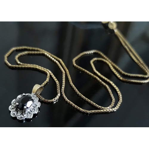 96 - A 9ct gold diamond and sapphire pendant on chain, length 40cm, gross wt. 2.3g.