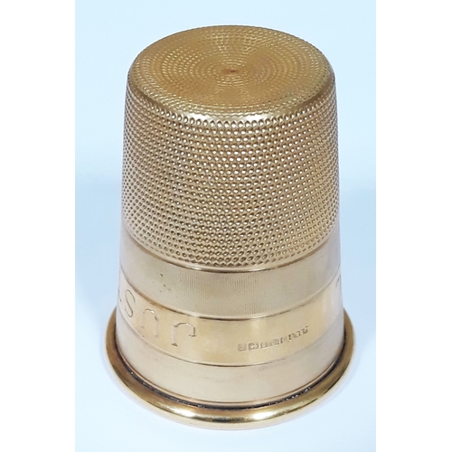 99 - A hallmarked 9ct gold novelty drinking tot modelled as a thimble, inscribed 'Just A Thimble Full', w... 