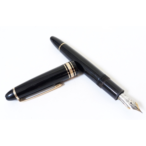 382 - A Montblanc Meisterstuck fountain pen with 14K gold nib.