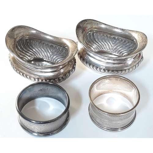 393 - Hallmarked silver comprising a pair of salts and two serviette rings, wt. 3oz.