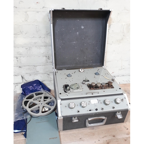 410 - A vintage Ferrograph 4/con reel to reel recorder with two reels and instruction manual.