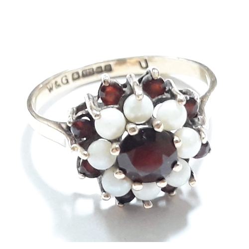 421 - A hallmarked 9ct gold garnet and pearl ring, gross wt. 2.8g.