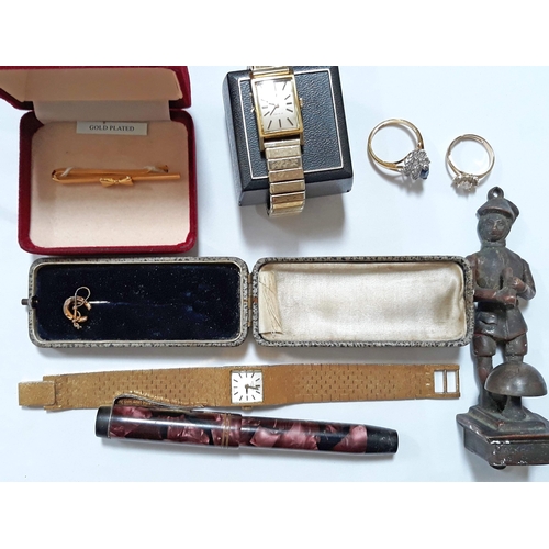 424 - A mixed lot comprising two gold plated watches, a vintage pen, a door knocker and costume jewellery.