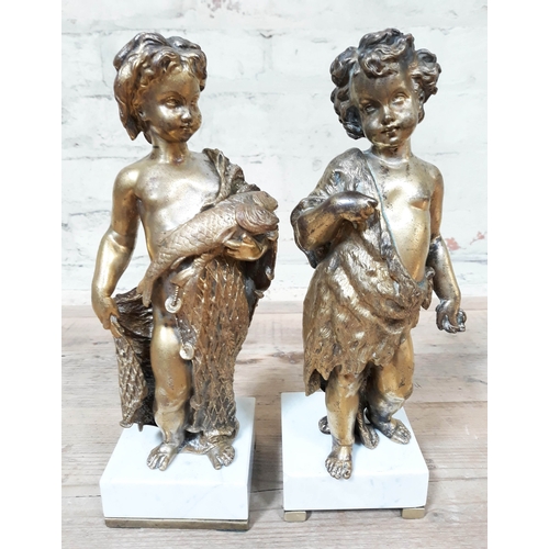 427 - A pair of gilt bronze cherubs on marble bases, height 29cm.