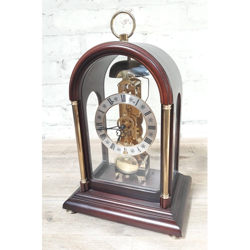 87 - A Franz Hermle dome cased mantle clock, height 33cm.