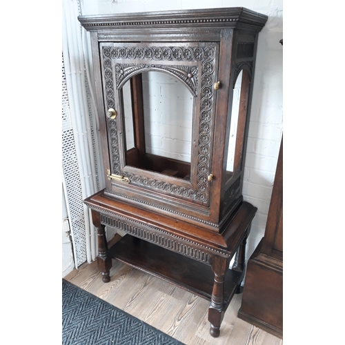 88 - A carved oak polyphon type cabinet.