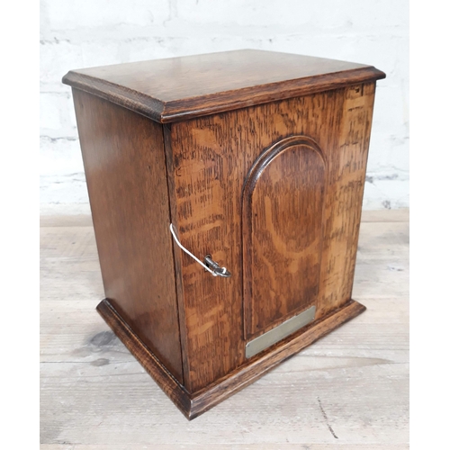 90 - An oak smoker's cabinet.