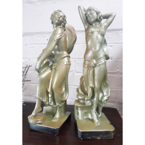 435 - A pair Art Deco plaster figures formed as female semi nudes.