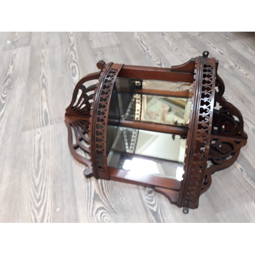 439 - An Edwardian mirror corner shelf.