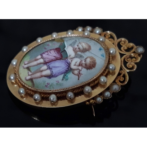 104 - A Continental yellow metal pendant brooch with central porcelain panel depicting cherubs surrounded ... 