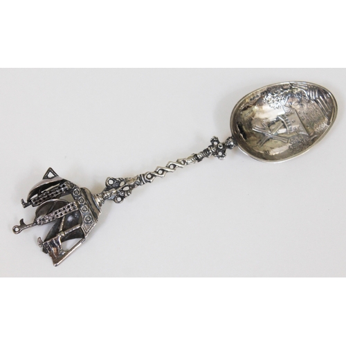 110 - A Dutch silver silver with galleon finial and embossed bowl depicting a windmill, length 20.5cm, wt.... 