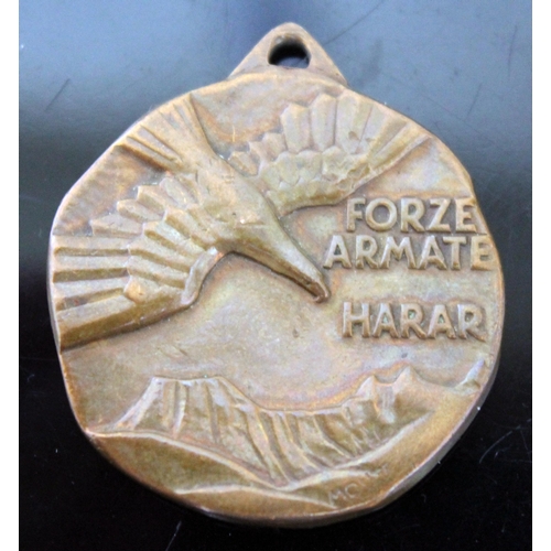 129 - An Italian WWII armed forces bronze medal.