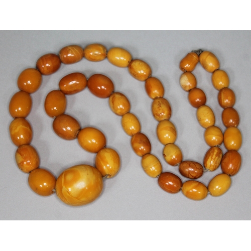 166 - A butterscotch amber bead necklace, beads ranging from 10mm - 24mm, length 56cm, gross wt. 41g.