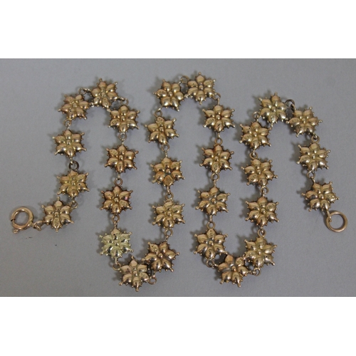 167 - An early 20th Century 9ct gold necklace formed as linked stylised flower heads, each marked '9ct', l... 