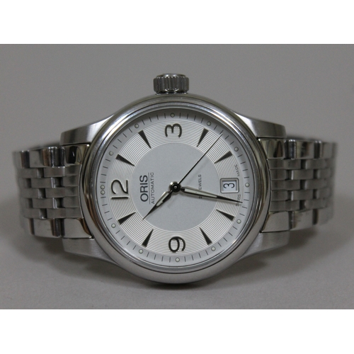 176 - An Oris Classic Date automatic stainless steel wristwatch, silvered dial with exhibition back, with ... 