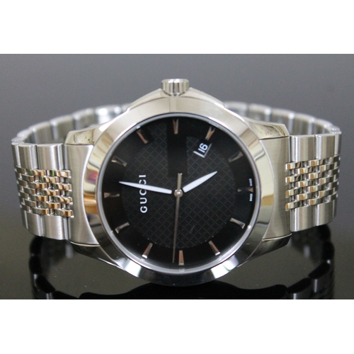 178 - A Gucci G Timeless stainless steel wristwatch, black dial with baton markers, luminous hands and dat... 