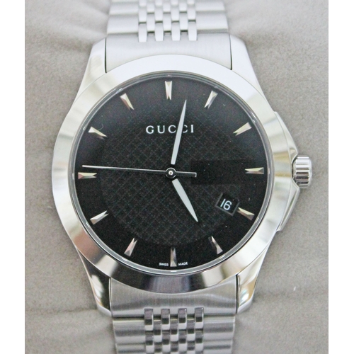 178 - A Gucci G Timeless stainless steel wristwatch, black dial with baton markers, luminous hands and dat... 