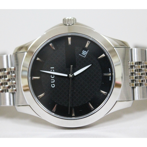 178 - A Gucci G Timeless stainless steel wristwatch, black dial with baton markers, luminous hands and dat... 