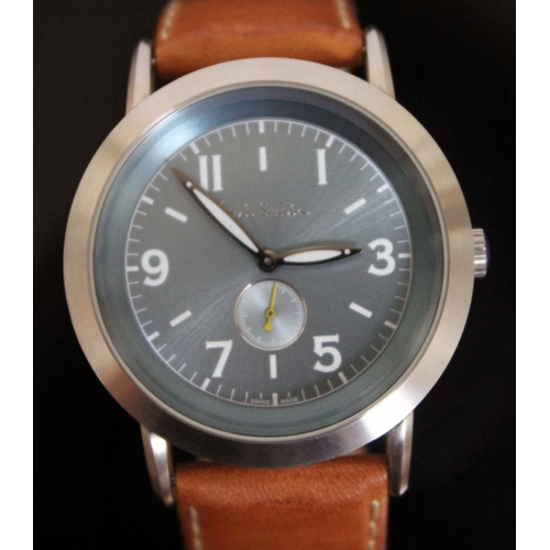 180 - A Paul Smith stainless steel wristwatch with tan leather strap, having quartz movement, aqua blue di... 