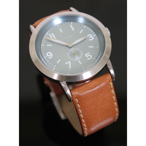 180 - A Paul Smith stainless steel wristwatch with tan leather strap, having quartz movement, aqua blue di... 