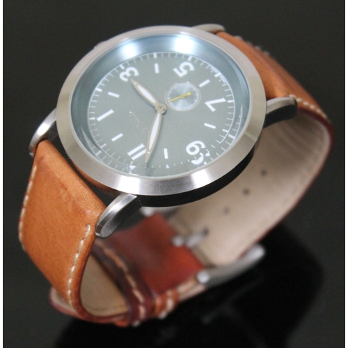 180 - A Paul Smith stainless steel wristwatch with tan leather strap, having quartz movement, aqua blue di... 