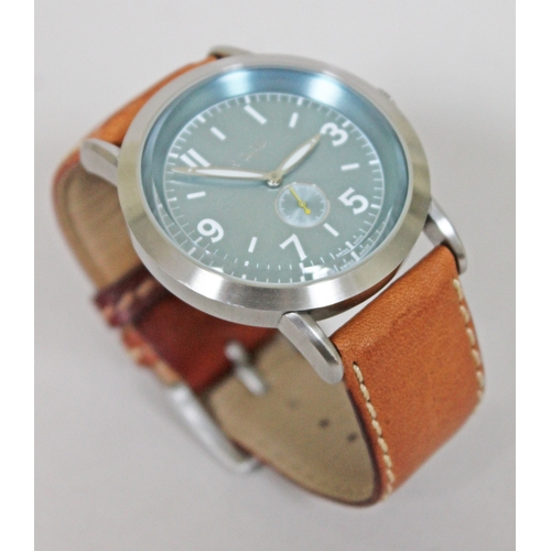 180 - A Paul Smith stainless steel wristwatch with tan leather strap, having quartz movement, aqua blue di... 