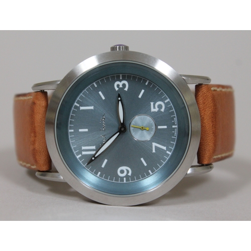 180 - A Paul Smith stainless steel wristwatch with tan leather strap, having quartz movement, aqua blue di... 