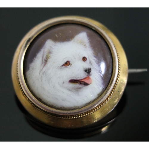 192 - A Victorian gold mounted brooch with enamel dog portrait signed 'W.B. Ford' and dated 1879, diam. 21... 