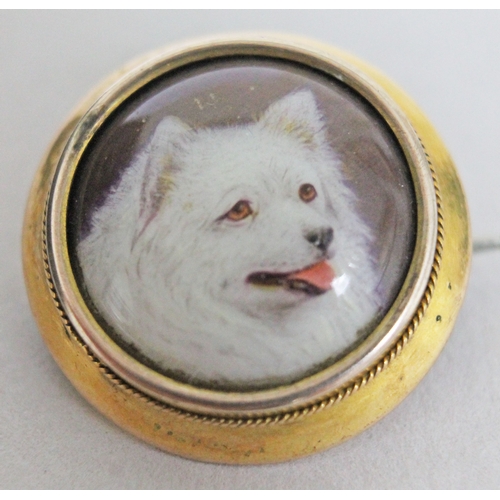 192 - A Victorian gold mounted brooch with enamel dog portrait signed 'W.B. Ford' and dated 1879, diam. 21... 