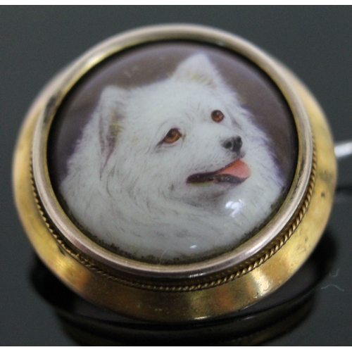 192 - A Victorian gold mounted brooch with enamel dog portrait signed 'W.B. Ford' and dated 1879, diam. 21... 