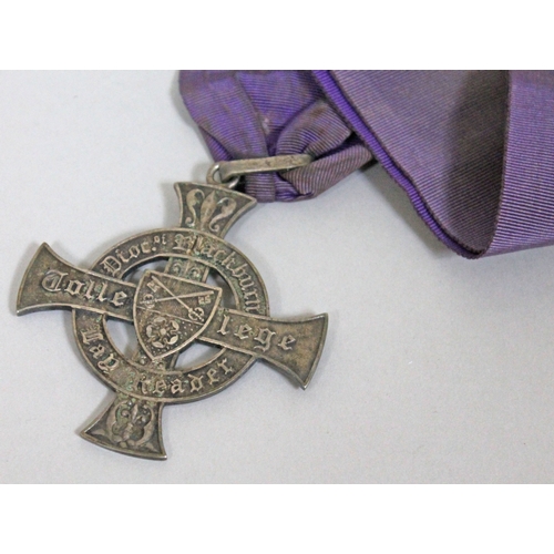 201 - A Diocese of Blackburn Church of England silver plated medallion on purple ribbon.