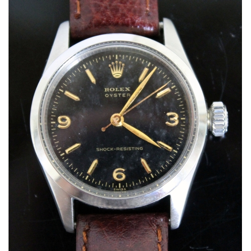 216 - A vintage Rolex Oyster Shock-Resisting stainless steel wristwatch circa 1955, black dial with gold h... 