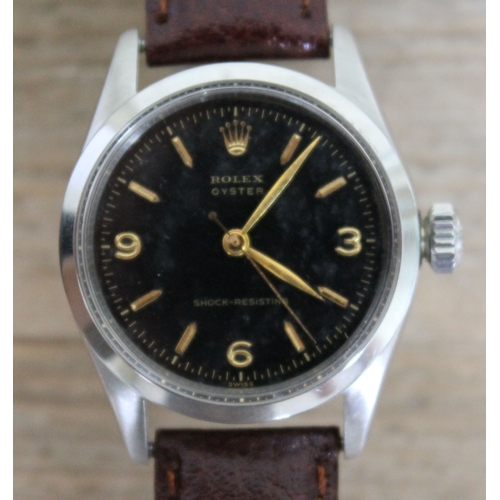 216 - A vintage Rolex Oyster Shock-Resisting stainless steel wristwatch circa 1955, black dial with gold h... 