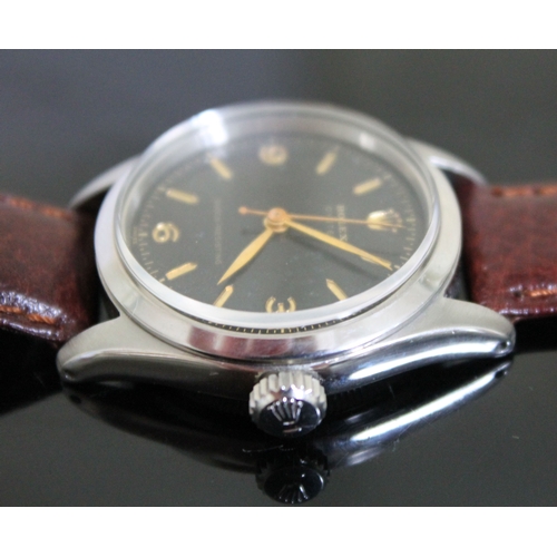 216 - A vintage Rolex Oyster Shock-Resisting stainless steel wristwatch circa 1955, black dial with gold h... 