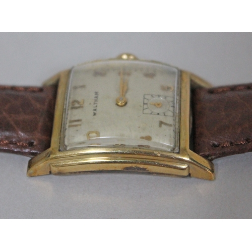 222 - An Art Deco Waltham 10K gold filled wristwatch, width 26mm, later leather strap.