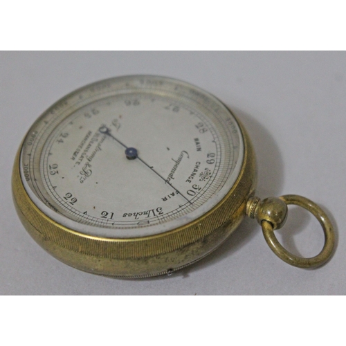 229 - A Victorian brass pocket barometer the dial inscribed 'Compensated' and 'F Armstrong & Bro... ....De... 