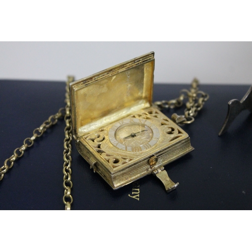 231 - A St James's House Company hallmarked silver gilt pendant watch in the form of a book, with silver g... 