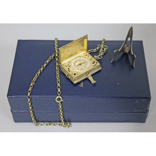 231 - A St James's House Company hallmarked silver gilt pendant watch in the form of a book, with silver g... 