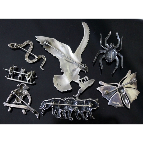 236 - A group of seven silver/white metal vintage animal brooches comprising a wolf pack brooch marked 'SC... 