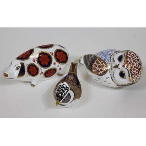 305 - A group of three Royal Crown Derby paperweights.