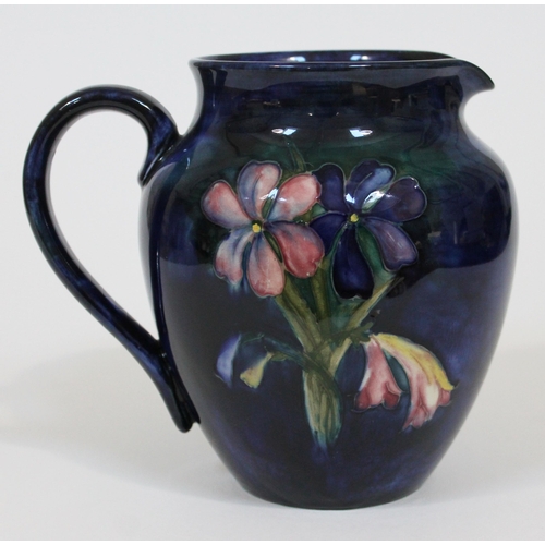 306 - A Moorcroft pottery Spring Flower jug, height 15cm.