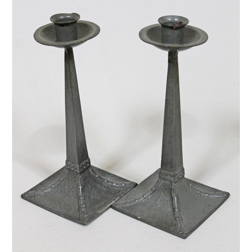 316 - A pair of Arts & Crafts pewter candlesticks possibly after a design by Jan Eisenloeffel, James Dixon... 