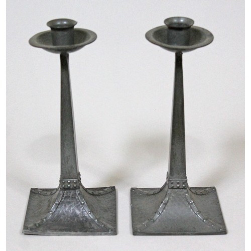 316 - A pair of Arts & Crafts pewter candlesticks possibly after a design by Jan Eisenloeffel, James Dixon... 