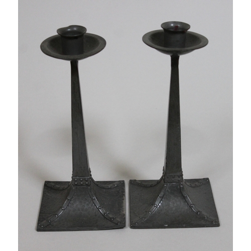 316 - A pair of Arts & Crafts pewter candlesticks possibly after a design by Jan Eisenloeffel, James Dixon... 