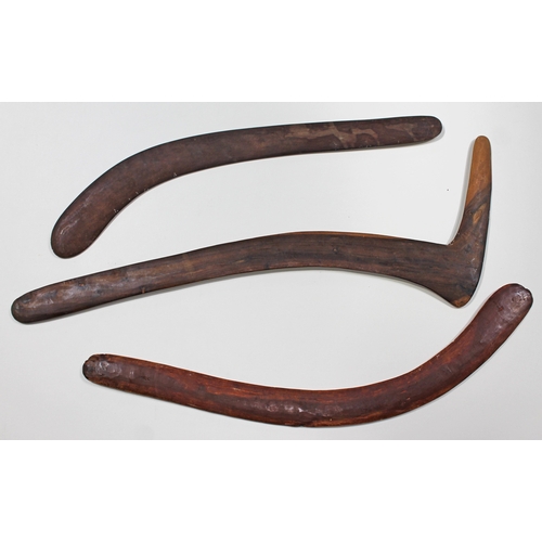 318 - A group of three Aboriginal boomerangs including a swan neck hunting throwing stick.