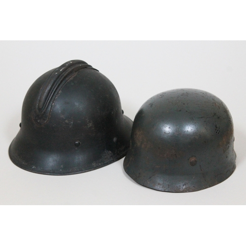 332 - Two WWII helmets comprising a Russian helmet with red star to front and another with Luftschutz insi... 