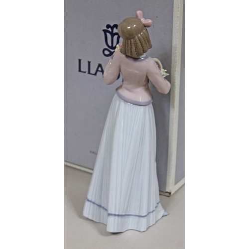 338 - A Lladro figure 'Innocence in Bloom' number 7644, height 24cm, boxed.