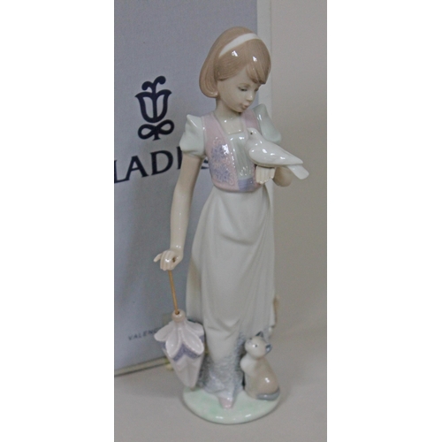 339 - A Lladro figure 'Summer Stroll' number 7611, height 23cm, with box.